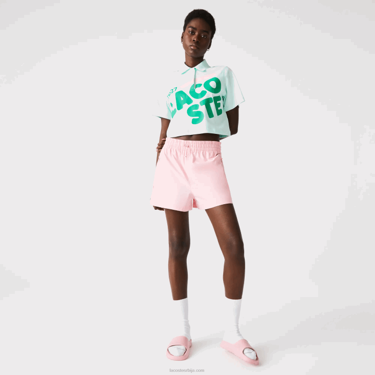 Жене лабав поло од органског памука са кратким принтом 86882526 тиркизно нре Lacoste