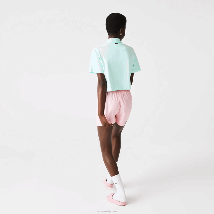 Жене лабав поло од органског памука са кратким принтом 86882526 тиркизно нре Lacoste