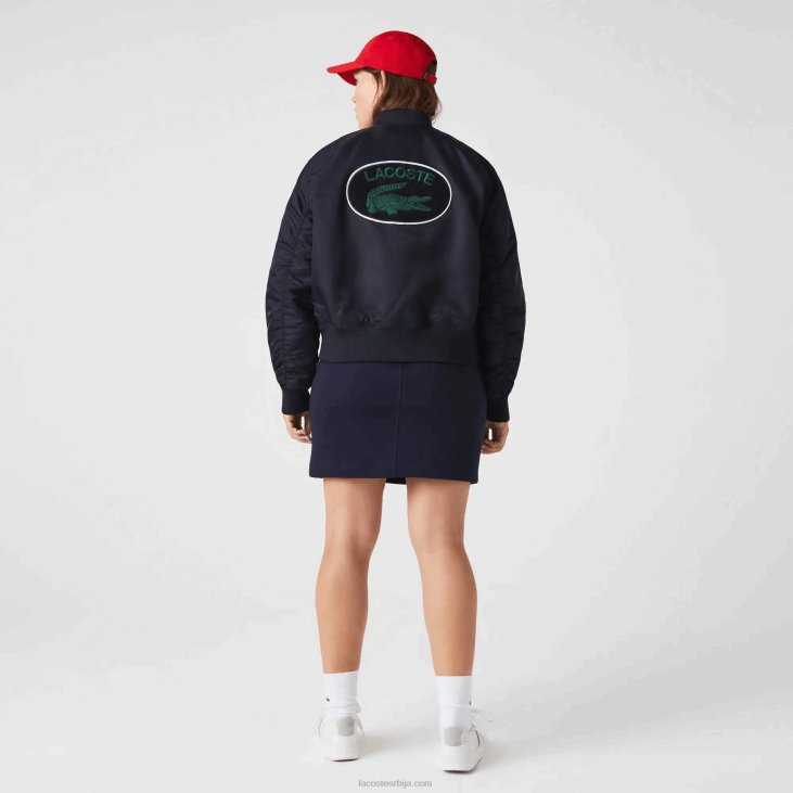 Жене прошивена најлонска јакна 86882623 тамноплава хде Lacoste