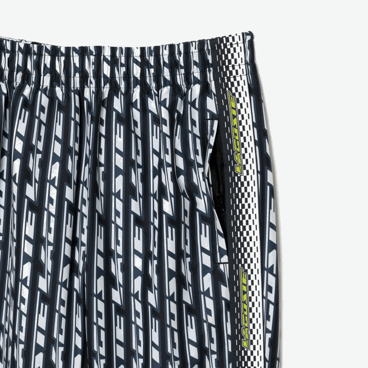 Жене панталоне са логом штампе 86882395 црно плаво бело зи8 Lacoste