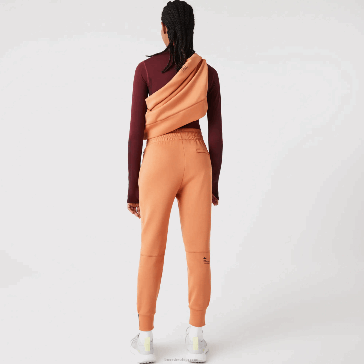 Жене памучне панталоне 86882405 наранџасти ввц Lacoste