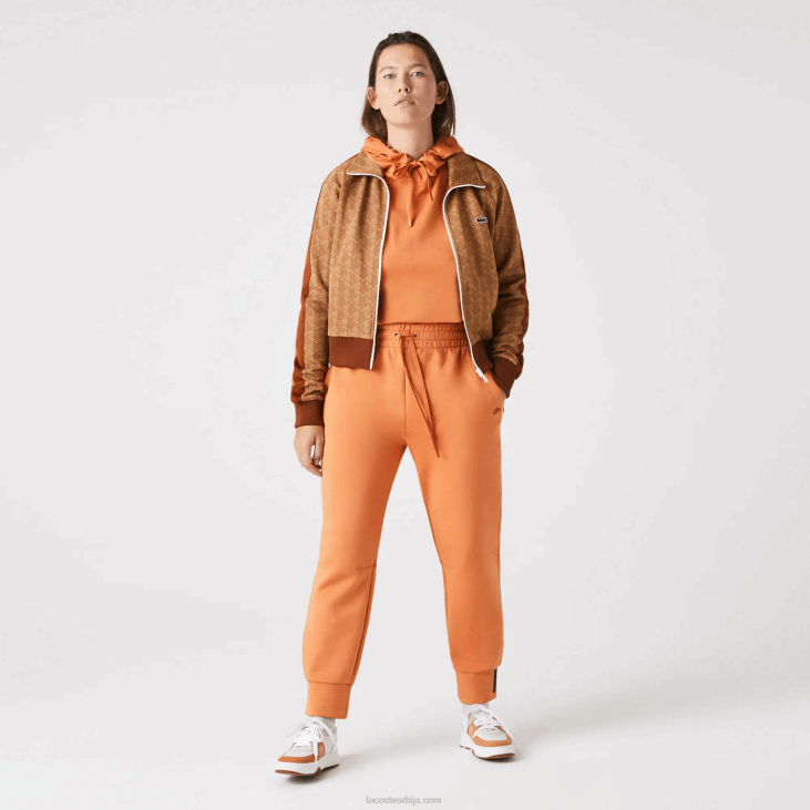 Жене памучне панталоне 86882405 наранџасти ввц Lacoste