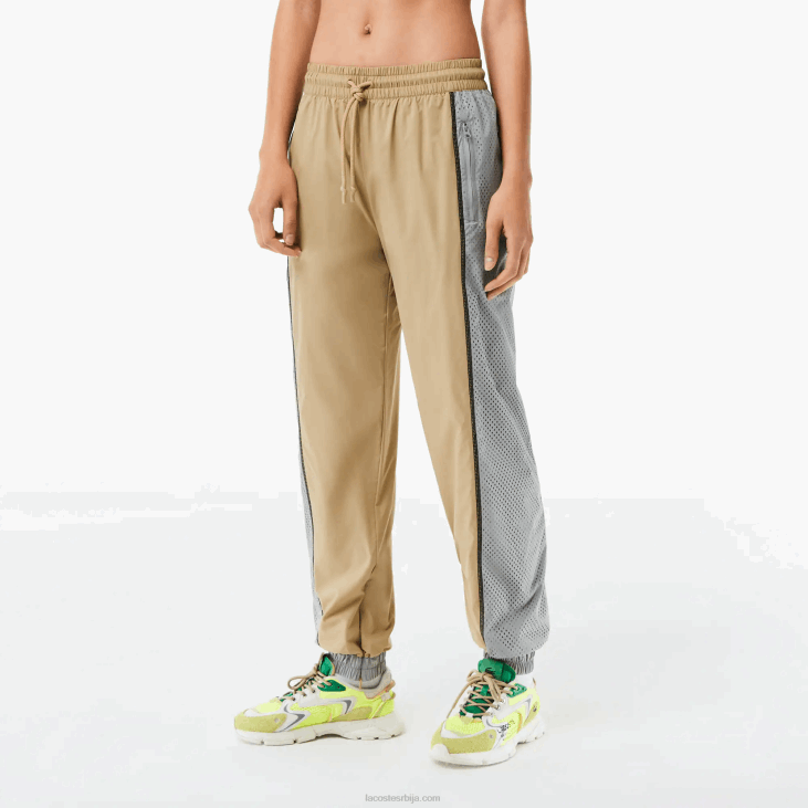 Жене панталоне са перфорираним ефектом 86882427 беж сива 7је Lacoste