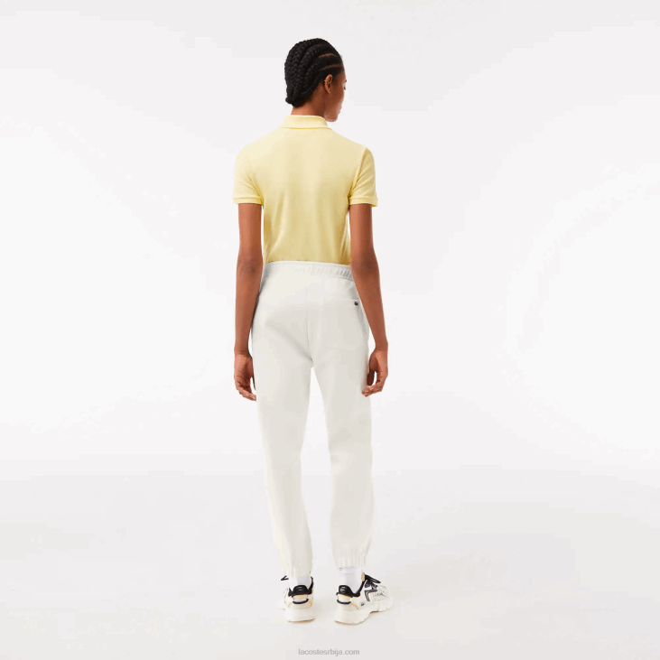 Жене џогери од мешаног памука 86882551 бела 70в Lacoste