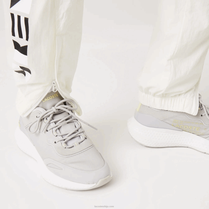 Жене панталоне са наутичким принтом 86882554 бела 70в Lacoste