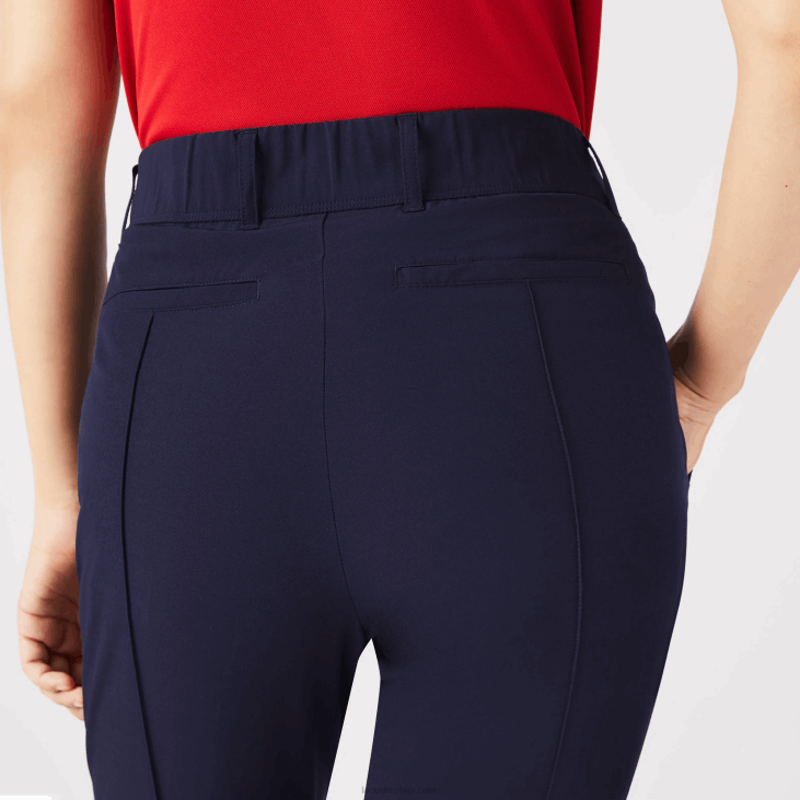 Жене спортске растезљиве панталоне за голф 86882658 тамноплава 166 Lacoste