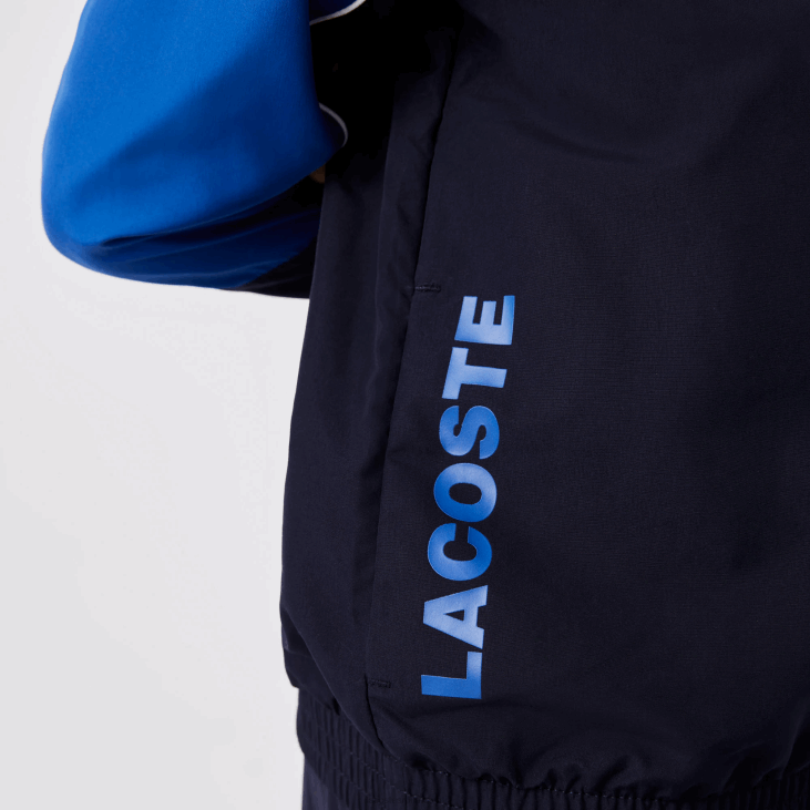 децаци спортска колор-блок тренерка 86883209 тамноплава 976 Lacoste