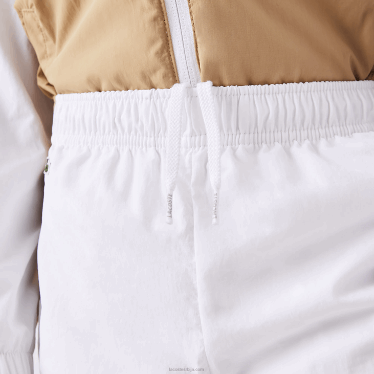 клинци панталоне са контрастним тракама 86883224 бело беж вн5 Lacoste