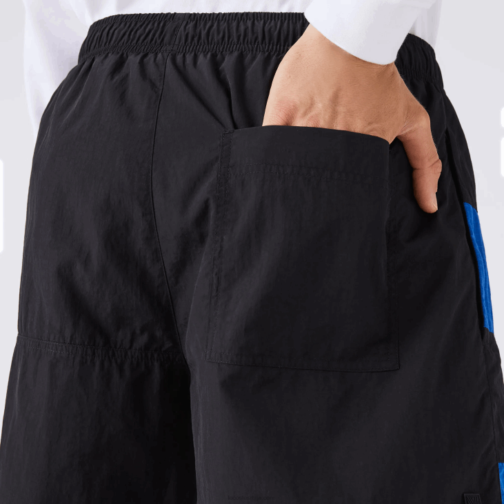 мушкарци Шортс са патцхворк ефектом у боји 86881500 црно плаво бело се1 Lacoste