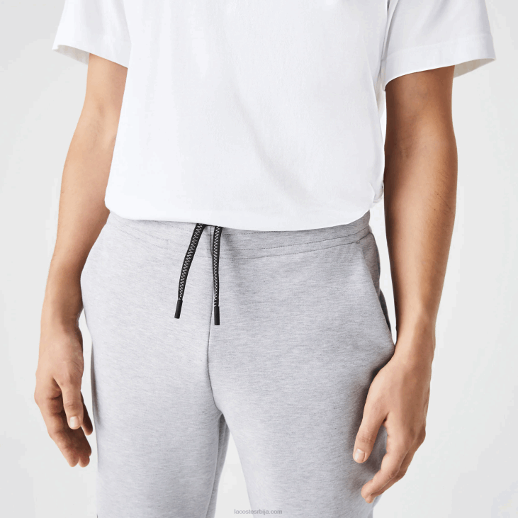 мушкарци панталоне са рефлектујућим принтом 86881044 сиви кине цца Lacoste