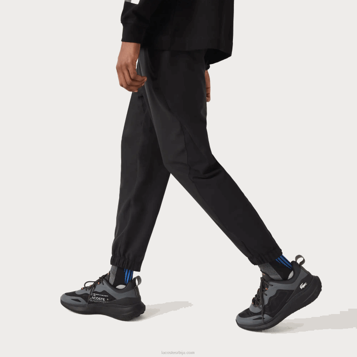 мушкарци спортске доње панталоне са рајсфершлусом 86881091 црна ц31 Lacoste