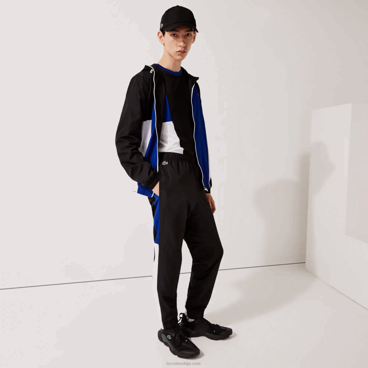 мушкарци спортске панталоне са колорблок тракама 86881129 црно плаво бело црно ару Lacoste