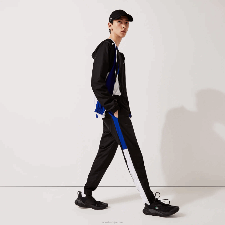 мушкарци спортске панталоне са колорблок тракама 86881129 црно плаво бело црно ару Lacoste