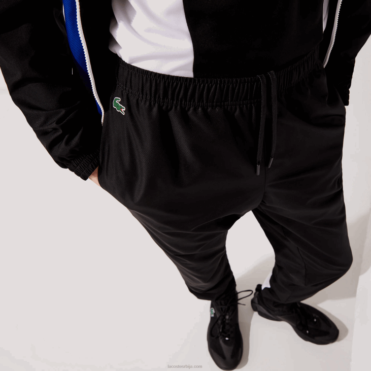 мушкарци спортске панталоне са колорблок тракама 86881129 црно плаво бело црно ару Lacoste