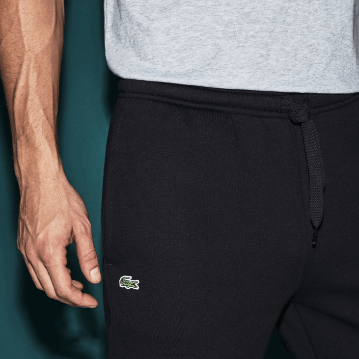 мушкарци спортске панталоне од флиса за тенис 86881151 тамноплава 166 Lacoste