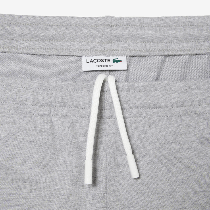мушкарци панталоне од небрушеног флиса 8688308 сиви кине цца Lacoste