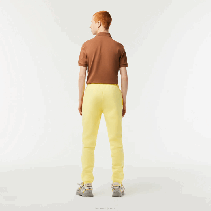 мушкарци панталоне од флиса суженог кроја 8688349 жута 107 Lacoste